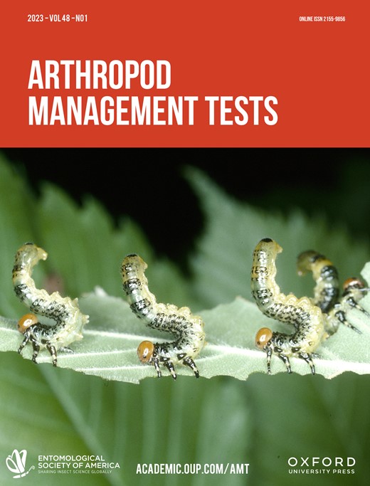 Cover of Arthropod Management Tests journal, the top third of which is solid red-orange with "Arthropod Management Tests" in all-caps white text. The bottom two-thirds of the journal cover is an image of several green caterpillars with orange-brown heads perched on a green leaf. All of the caterpillars are holding on to the leaf with their forelegs and have their tail ends arched upwards into the air. 
