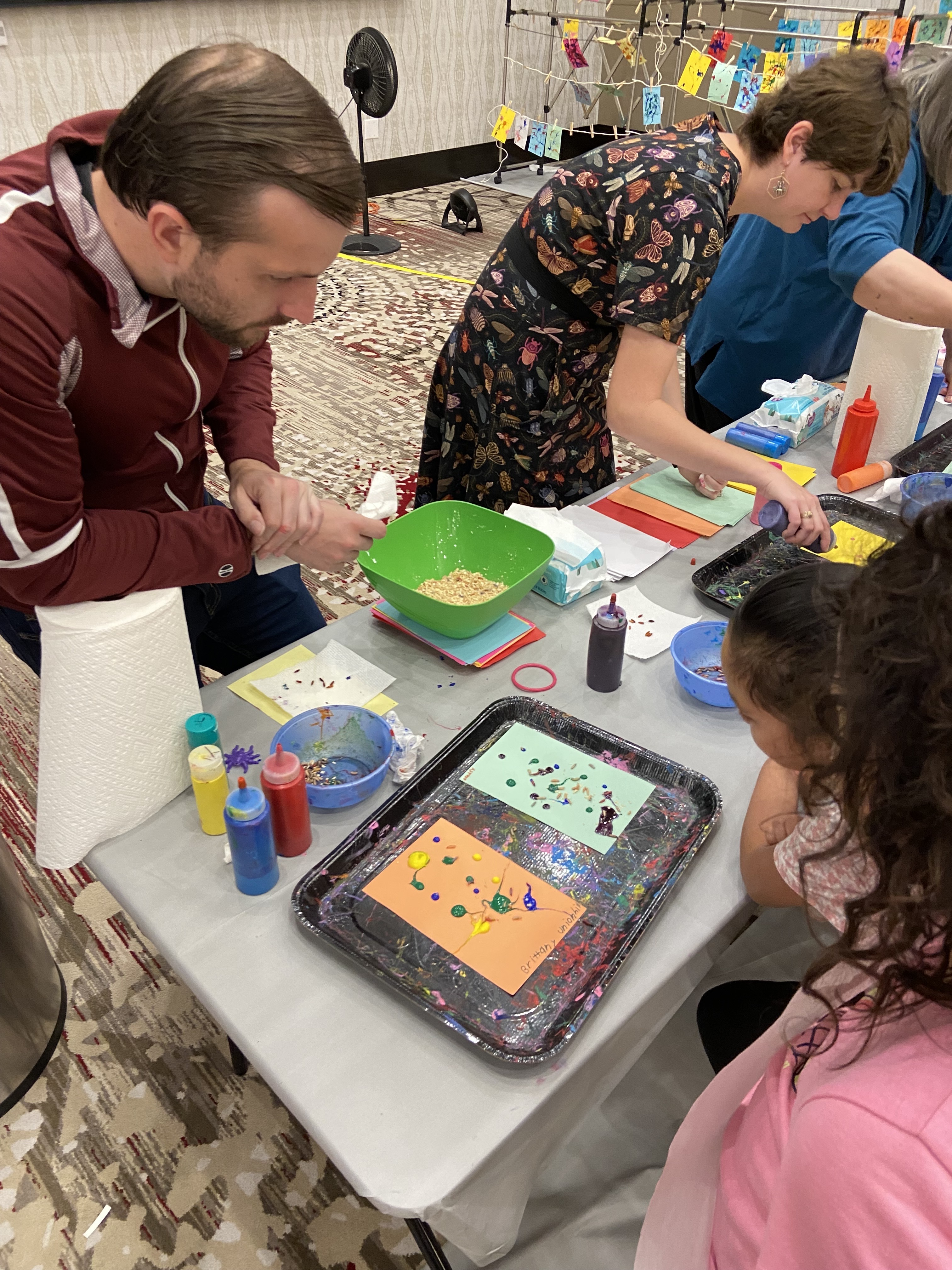 man showing girl insect activity